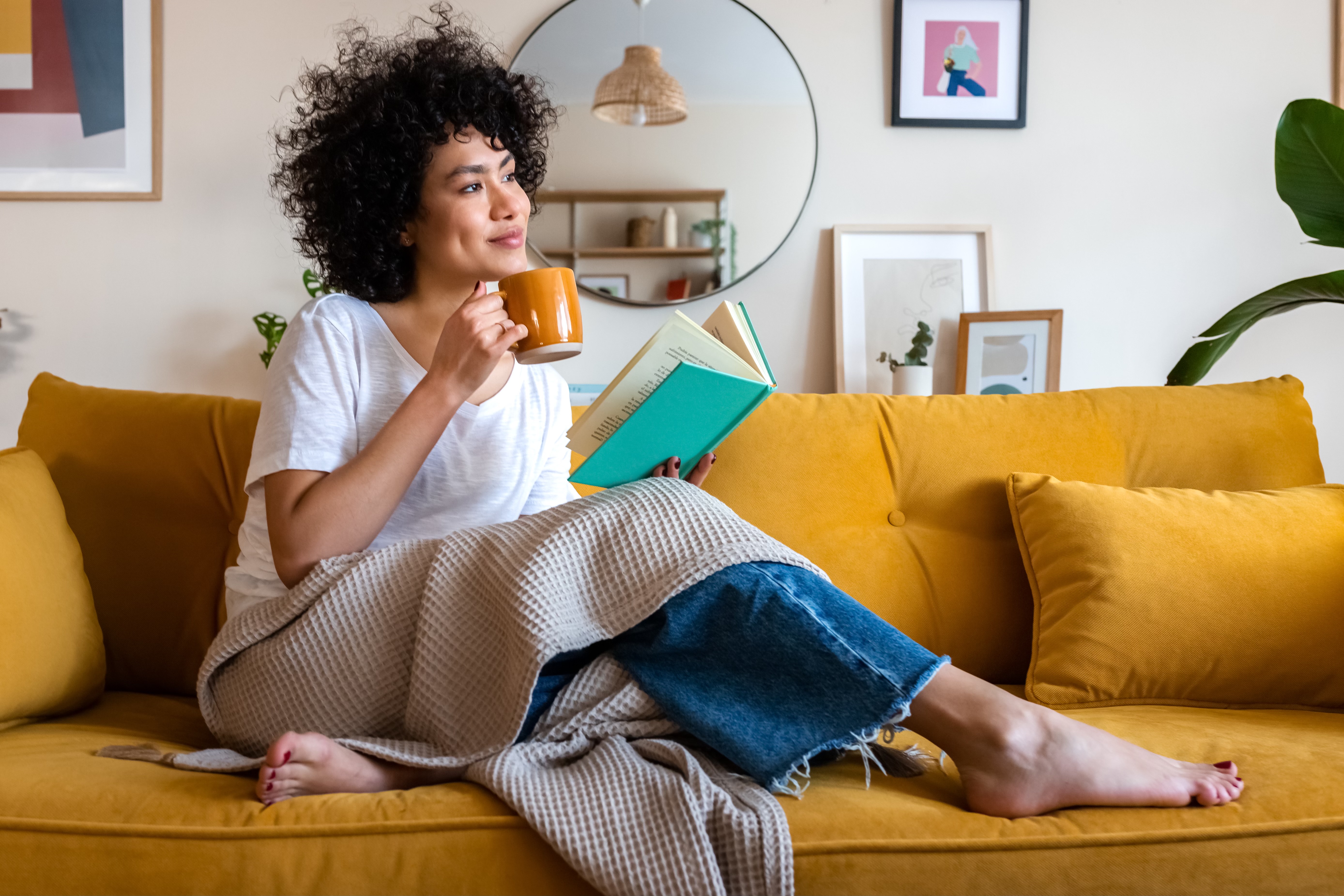 Woman reading calmly at home for relief from overwhelm